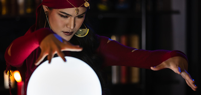 woman psychic gazing into crystal ball